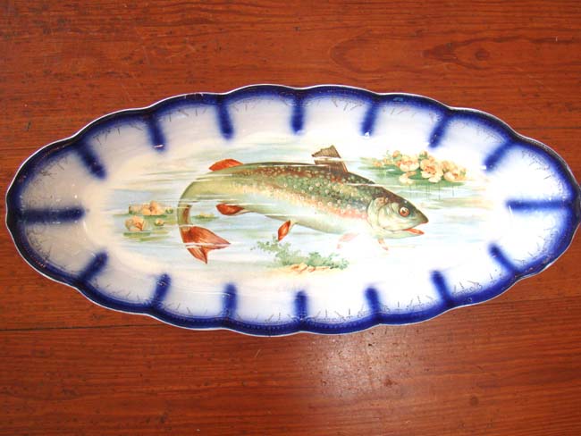 An attractive late 19th century hand painted fish serving platter